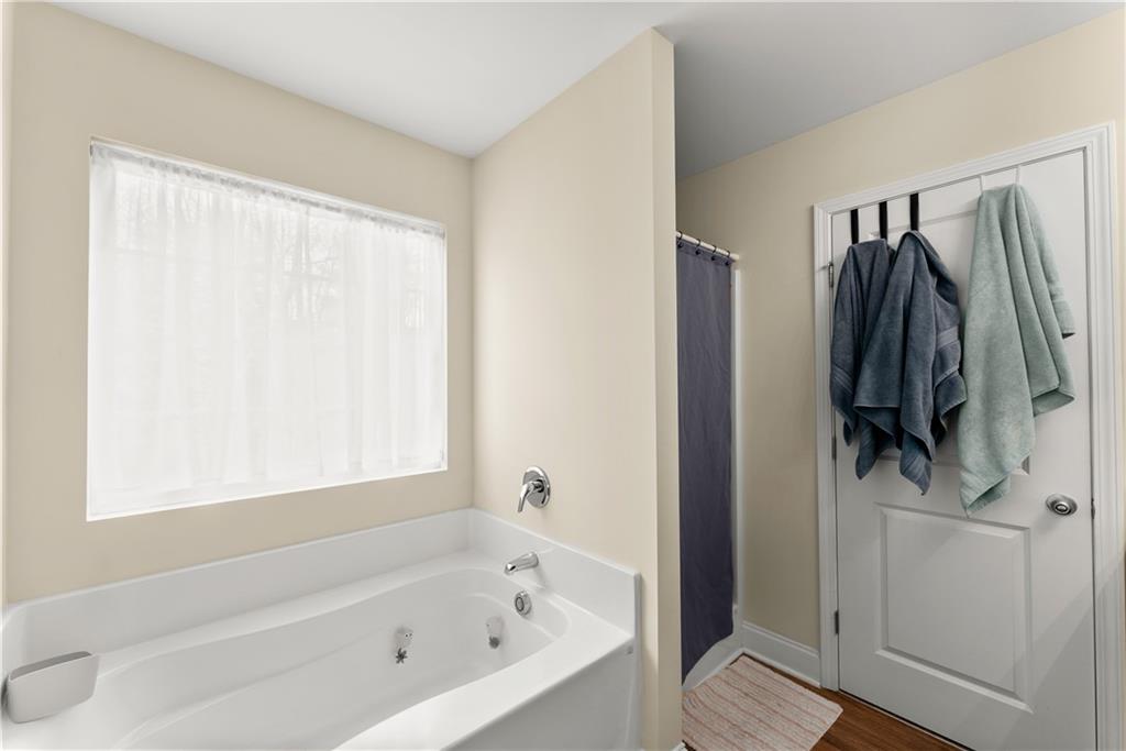 5430 Stepstone Way Gainesville, GA 30506 - Photo 21 of 39 a bathroom with a bathtub and a shower