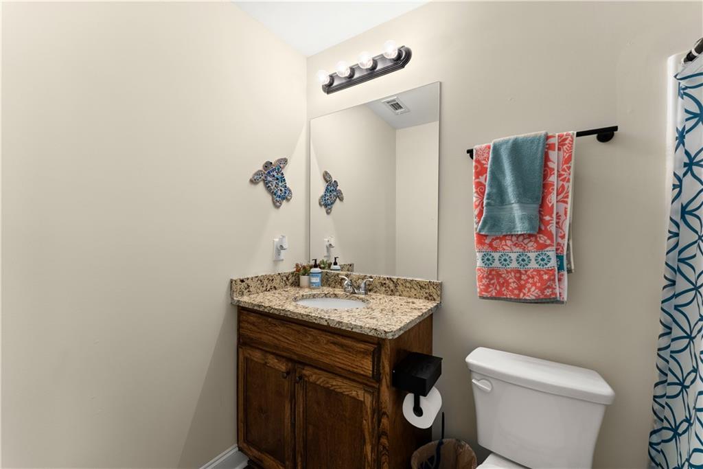 5430 Stepstone Way Gainesville, GA 30506 - Photo 23 of 39 a bathroom with a sink and a toilet