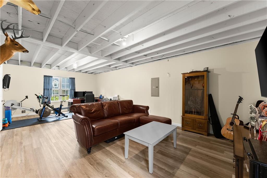 5430 Stepstone Way Gainesville, GA 30506 - Photo 27 of 39 a living room with furniture and a wooden floor