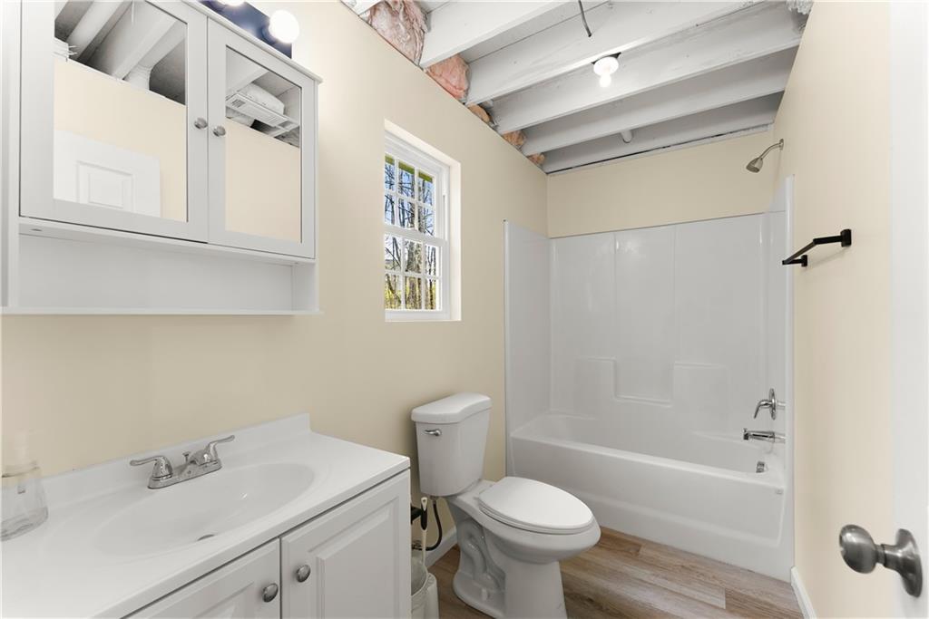 5430 Stepstone Way Gainesville, GA 30506 - Photo 30 of 39 a bathroom with a sink toilet and shower