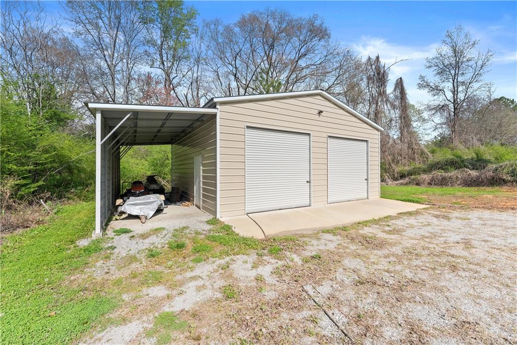 5430 Stepstone Way Gainesville, GA 30506 - Photo 32 of 39 a view of a house with backyard and garden