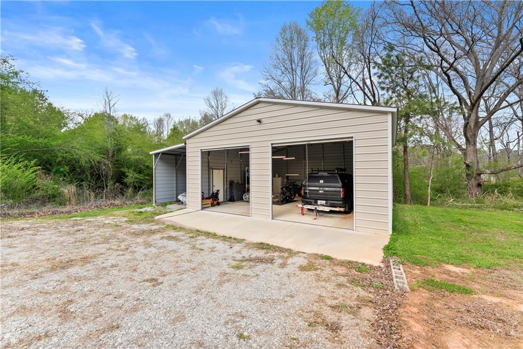 5430 Stepstone Way Gainesville, GA 30506 - Photo 34 of 39 a view of a house with backyard and porch