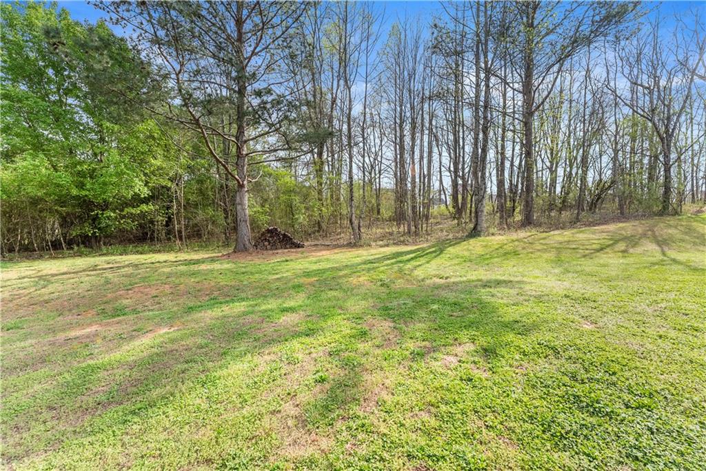 5430 Stepstone Way Gainesville, GA 30506 - Photo 36 of 39 a swimming pool with trees in the background