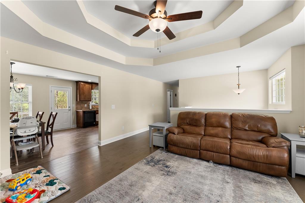 5430 Stepstone Way Gainesville, GA 30506 - Photo 10 of 39 a living room with furniture and wooden floor