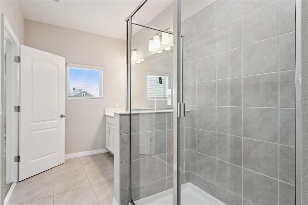 1915 Terrapin Road Ocoee, FL 34761 - Photo 13 of 25 a bathroom with a shower