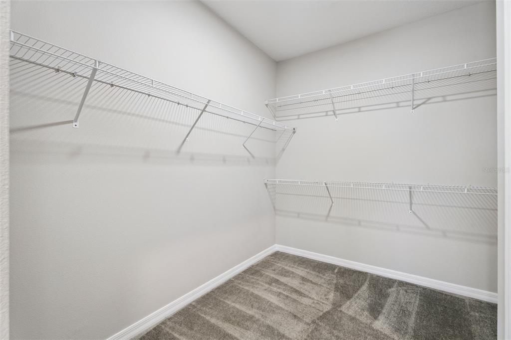 1915 Terrapin Road Ocoee, FL 34761 - Photo 14 of 25 a view of a room with racks on the wall