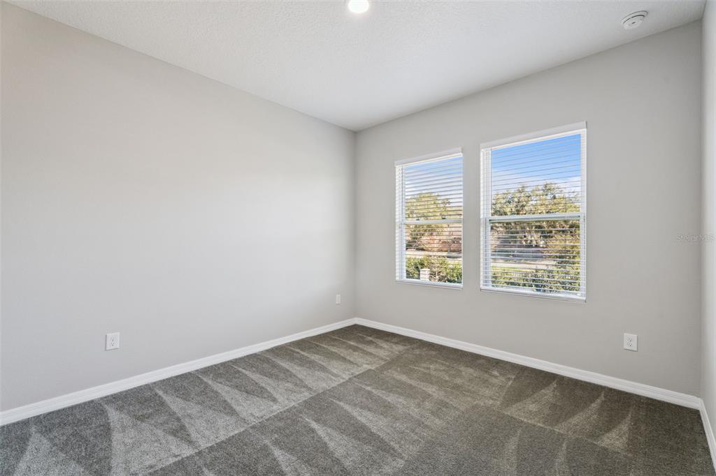 1915 Terrapin Road Ocoee, FL 34761 - Photo 16 of 25 a view of an empty room with a window