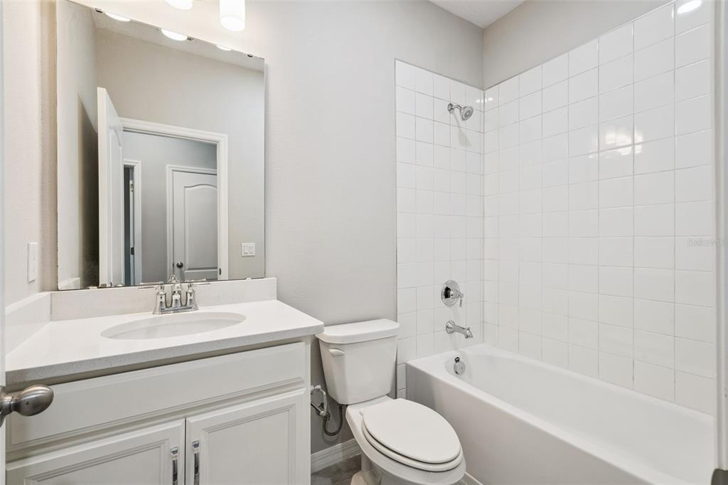 1915 Terrapin Road Ocoee, FL 34761 - Photo 17 of 25 a bathroom with a sink a toilet and shower