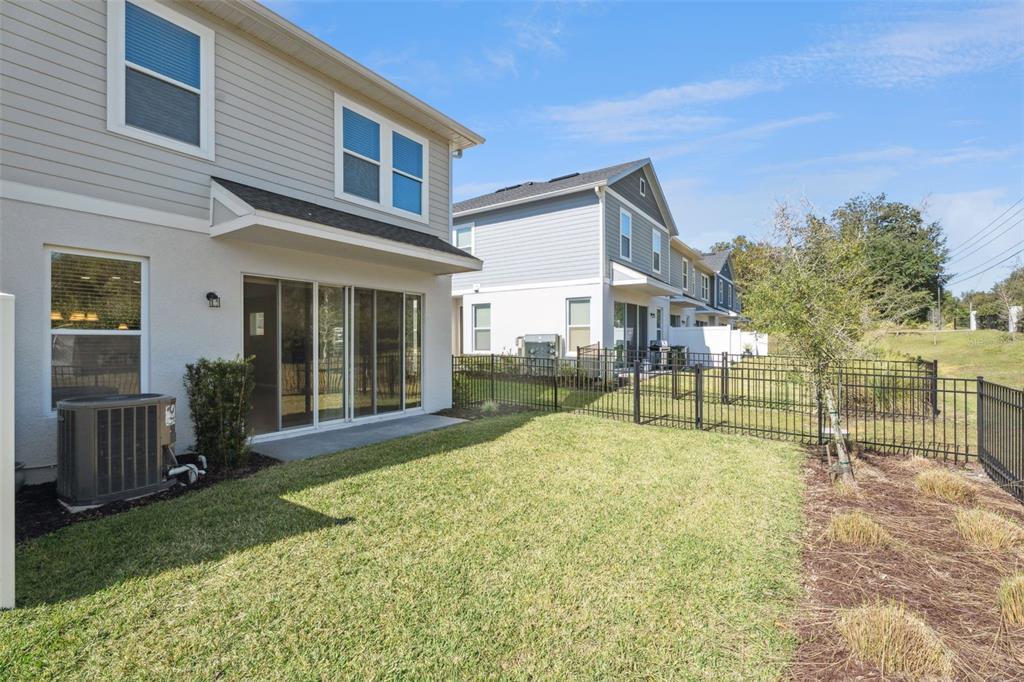 1915 Terrapin Road Ocoee, FL 34761 - Photo 19 of 25 a view of a house with backyard and a tree