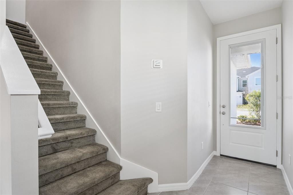 1915 Terrapin Road Ocoee, FL 34761 - Photo 2 of 25 a view of an entryway with staircase