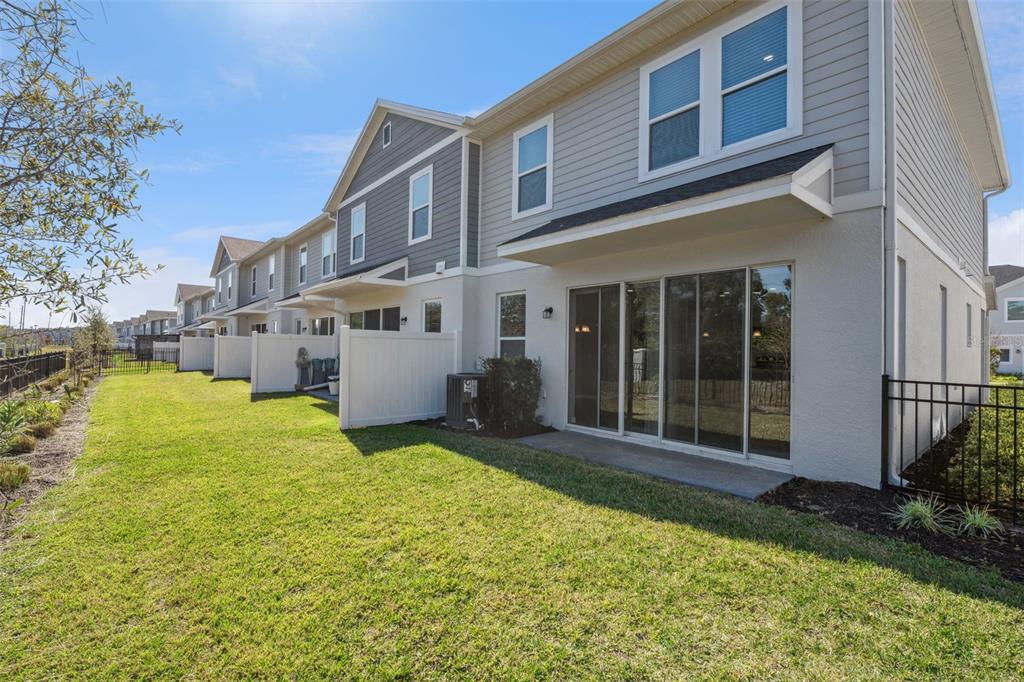 1915 Terrapin Road Ocoee, FL 34761 - Photo 21 of 25 a view of a building with a yard