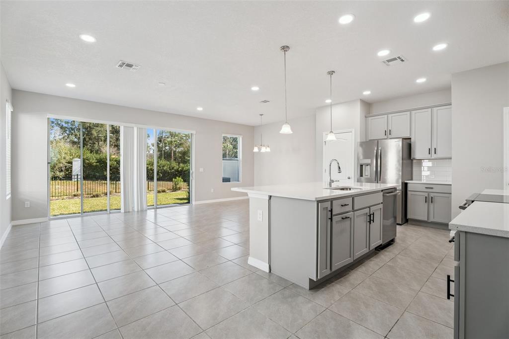 1915 Terrapin Road Ocoee, FL 34761 - Photo 6 of 25 a large kitchen with stainless steel appliances lots of counter top space