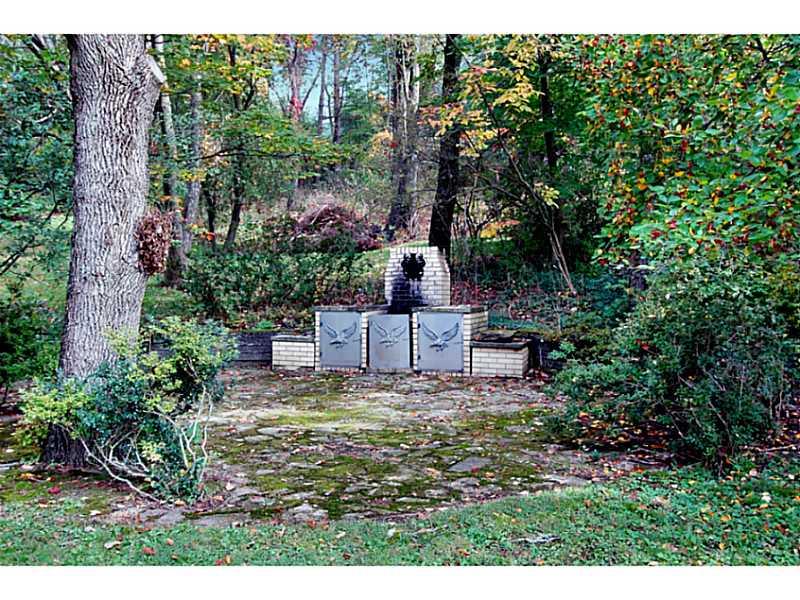 473 Perrymont Road Pittsburgh, PA 15237 - Photo 19 of 25 Yard/Garden. This stone grill at the far end of the back yard is situated on a patio and surrounded by nature. This is a great outdoor entertaining space!
