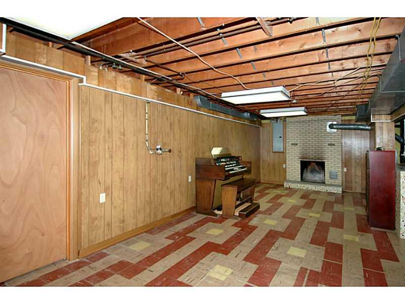 473 Perrymont Road Pittsburgh, PA 15237 - Photo 21 of 25 Other. View of HUGE lower level game room showing the 2nd fireplace, also wood burning. To the left is the door to the 2nd full bathroom.