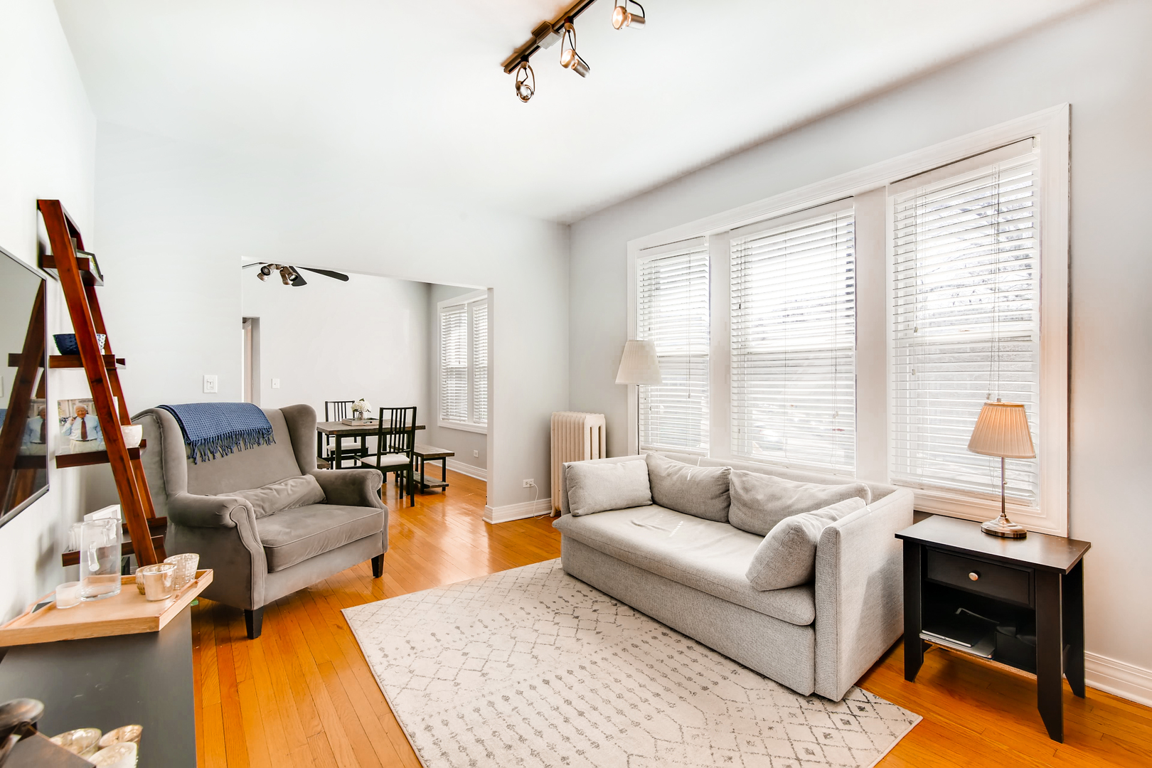 5707 North Ridge Avenue, Unit 2 Chicago, IL 60660 - Photo 2 of 11 a living room with furniture and a large window