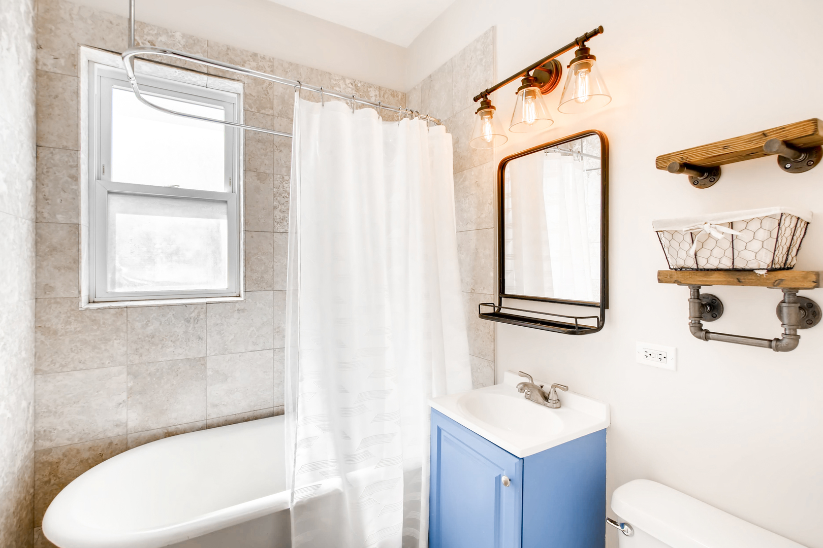5707 North Ridge Avenue, Unit 2 Chicago, IL 60660 - Photo 11 of 11 a bathroom with a sink toilet and shower