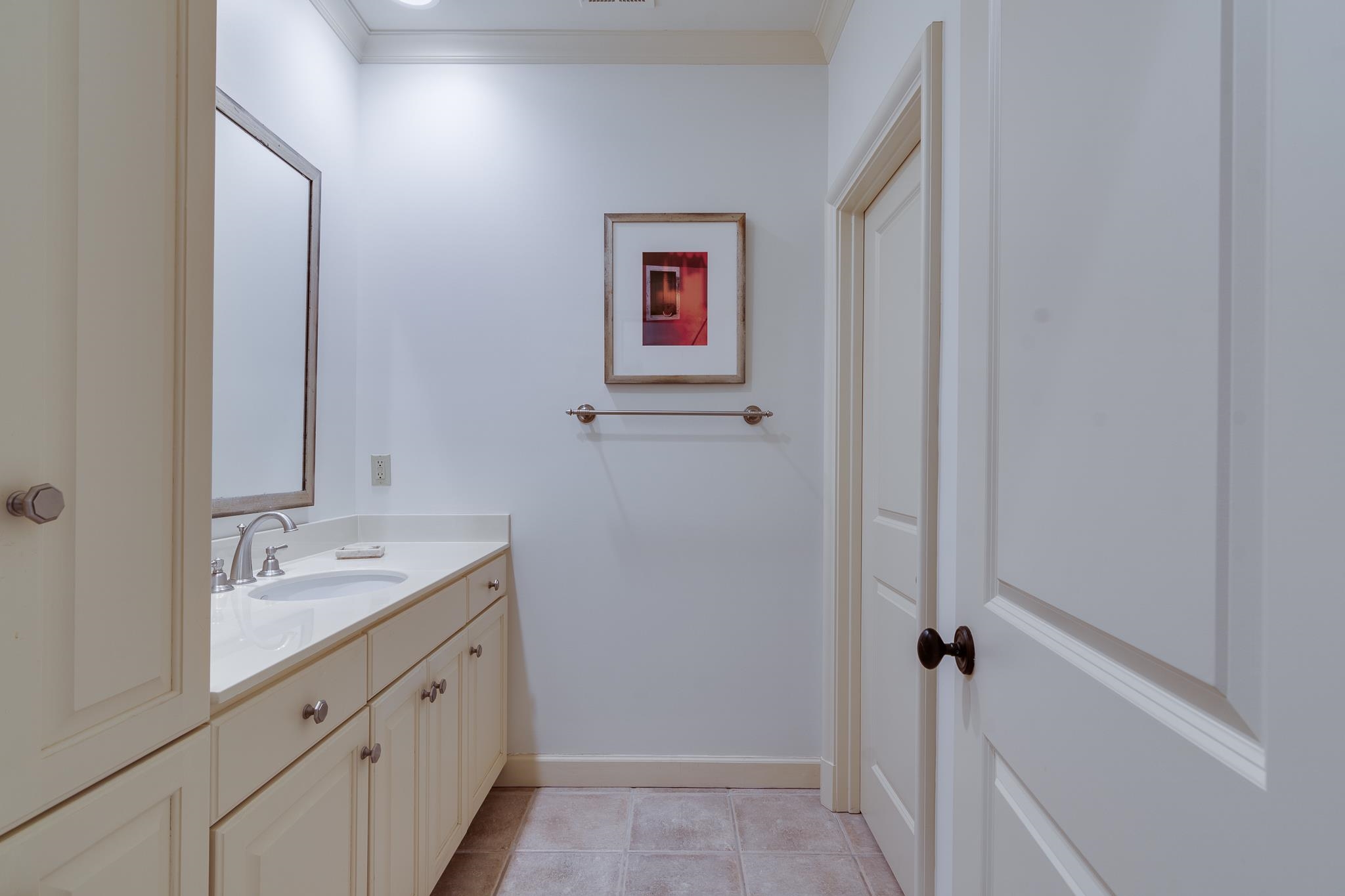 4865 Roane Road Memphis, TN 38117 - Photo 29 of 39 a bathroom with a granite countertop sink and a mirror