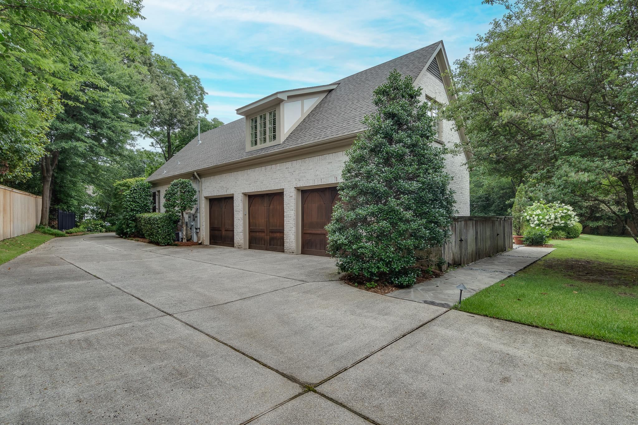 4865 Roane Road Memphis, TN 38117 - Photo 38 of 39 front view of a house with a yard and trees