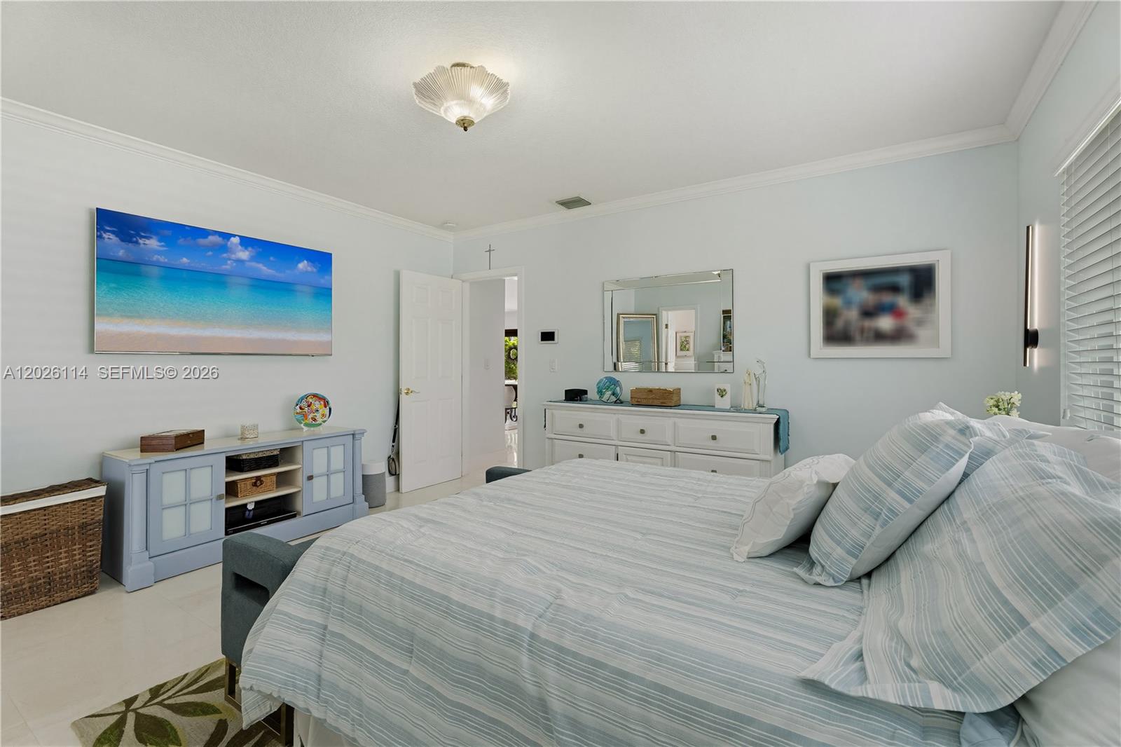 9641 Southwest 66th Street Miami, FL 33173 - Photo 29 of 57 a bedroom with a bed and a desk