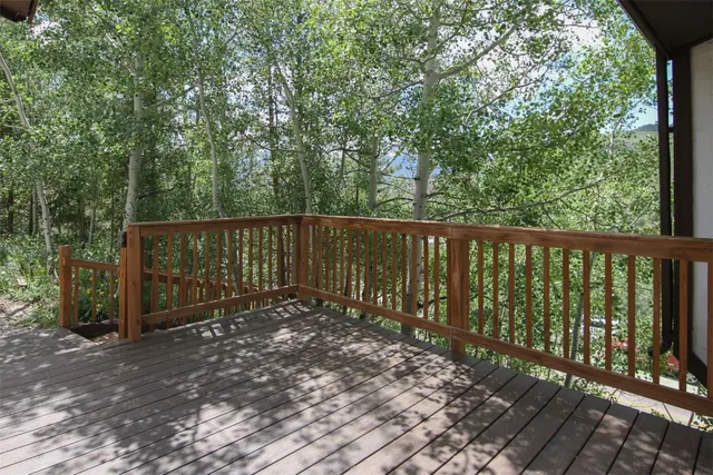 a view of a balcony with wooden floor