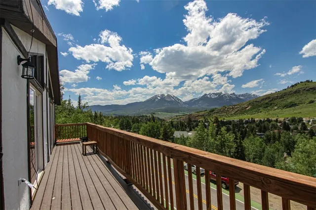 a view of a two chairs in the balcony