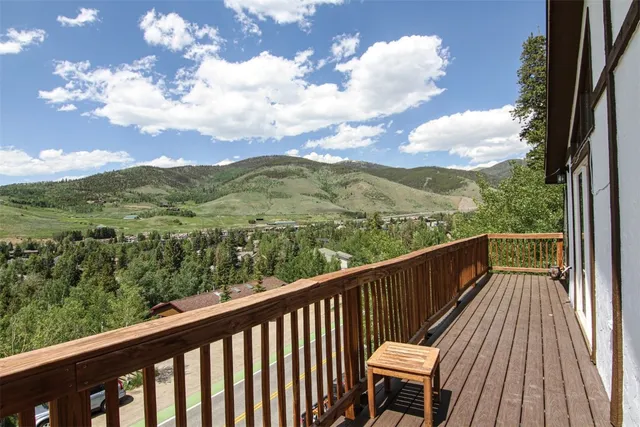 a view of a lake in middle of forest