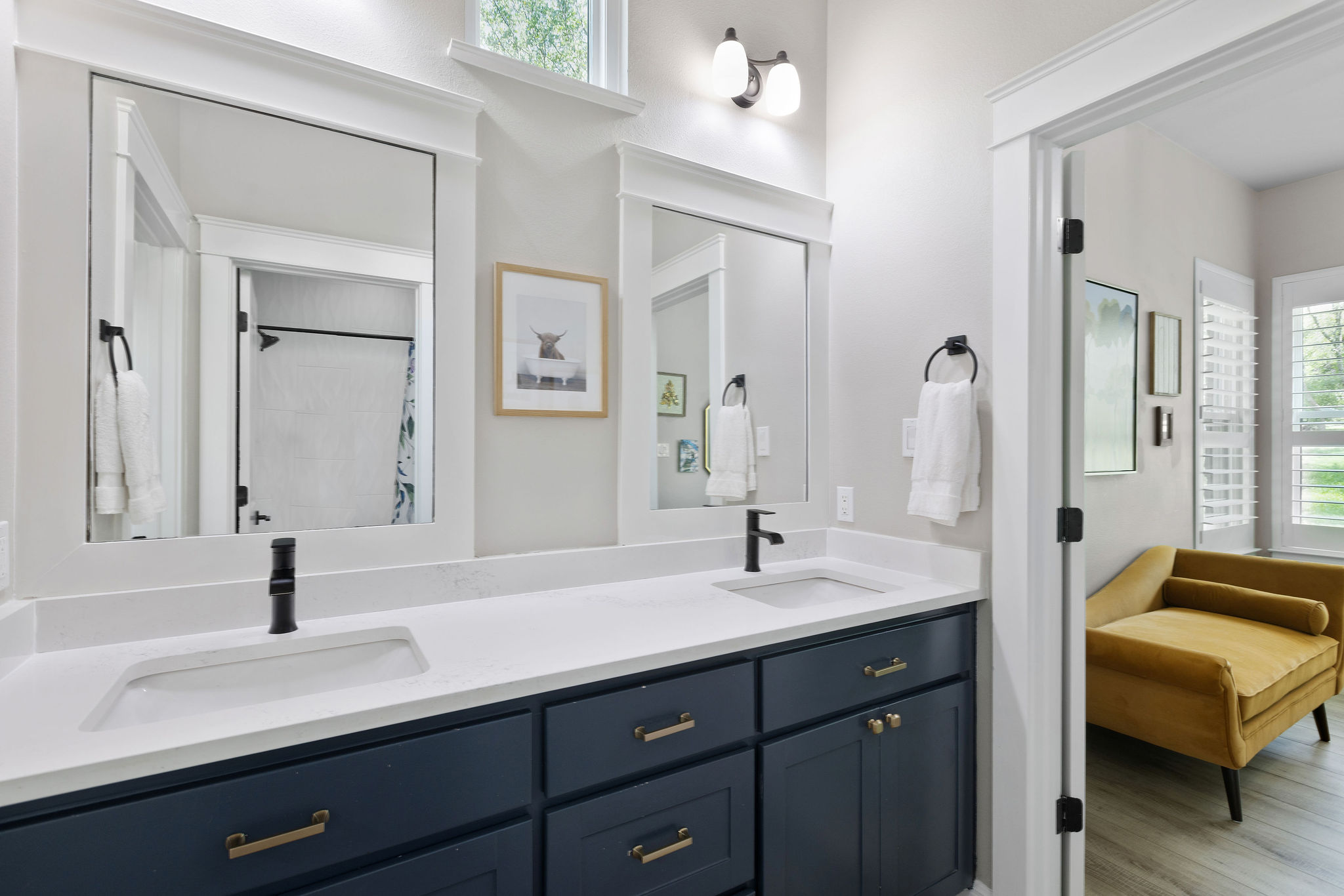 279 Rugged Earth Drive Austin, TX 78737 - Photo 35 of 40 a en suite bathroom with a double vanity sink and mirror