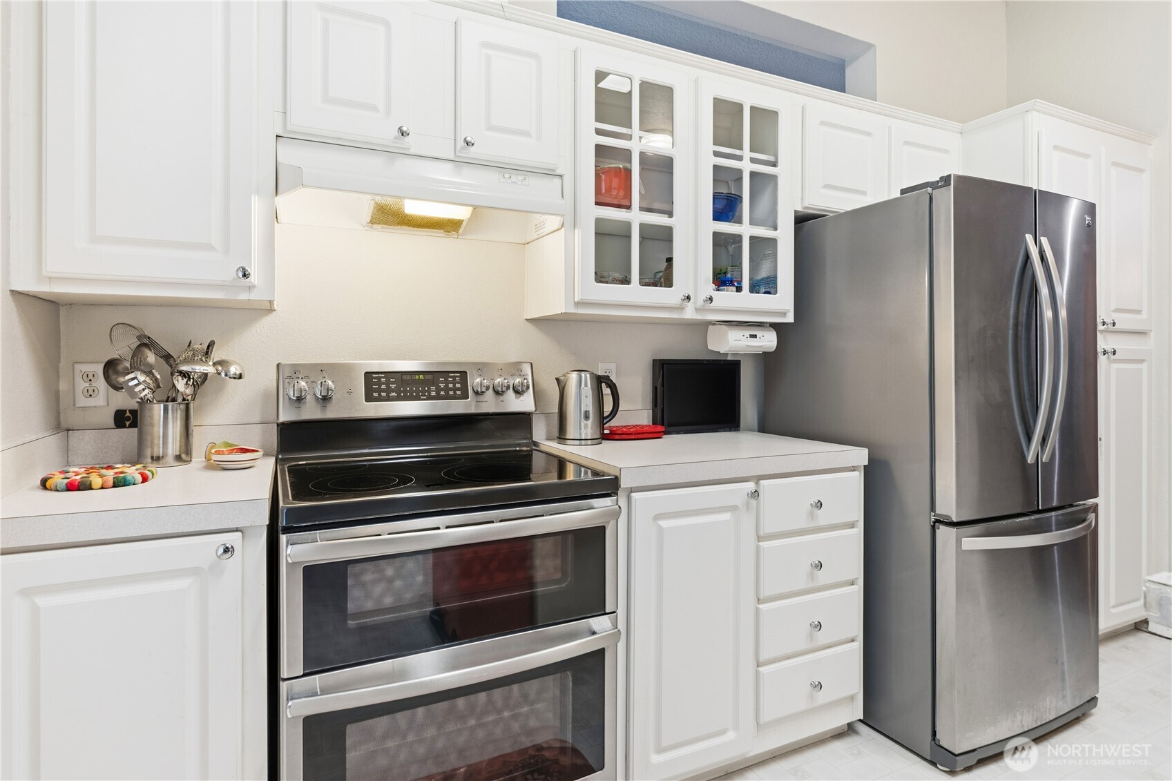 522 Frederick Street Port Townsend, WA 98368 - Photo 13 of 37 a kitchen with cabinets and stainless steel appliances