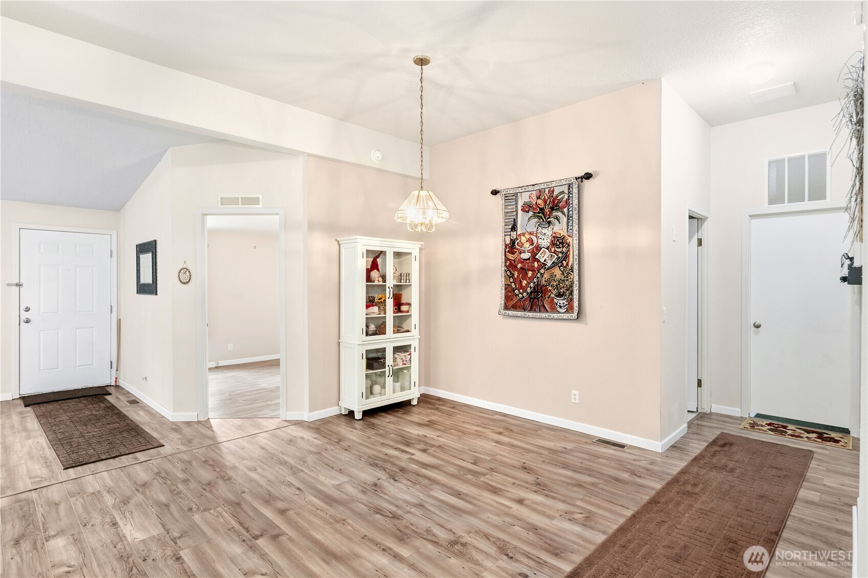 522 Frederick Street Port Townsend, WA 98368 - Photo 17 of 37 a view of a room with wooden floor and white walls