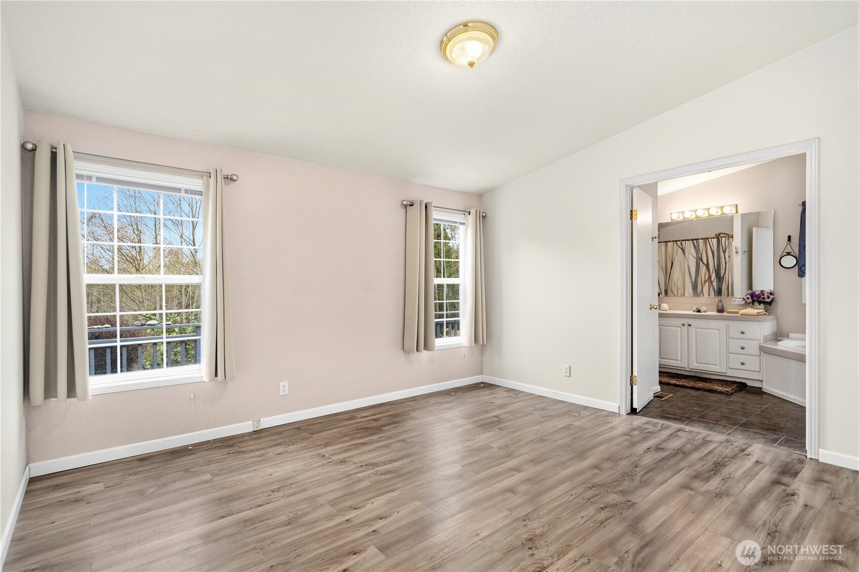 522 Frederick Street Port Townsend, WA 98368 - Photo 18 of 37 an empty room with wooden floor and a window
