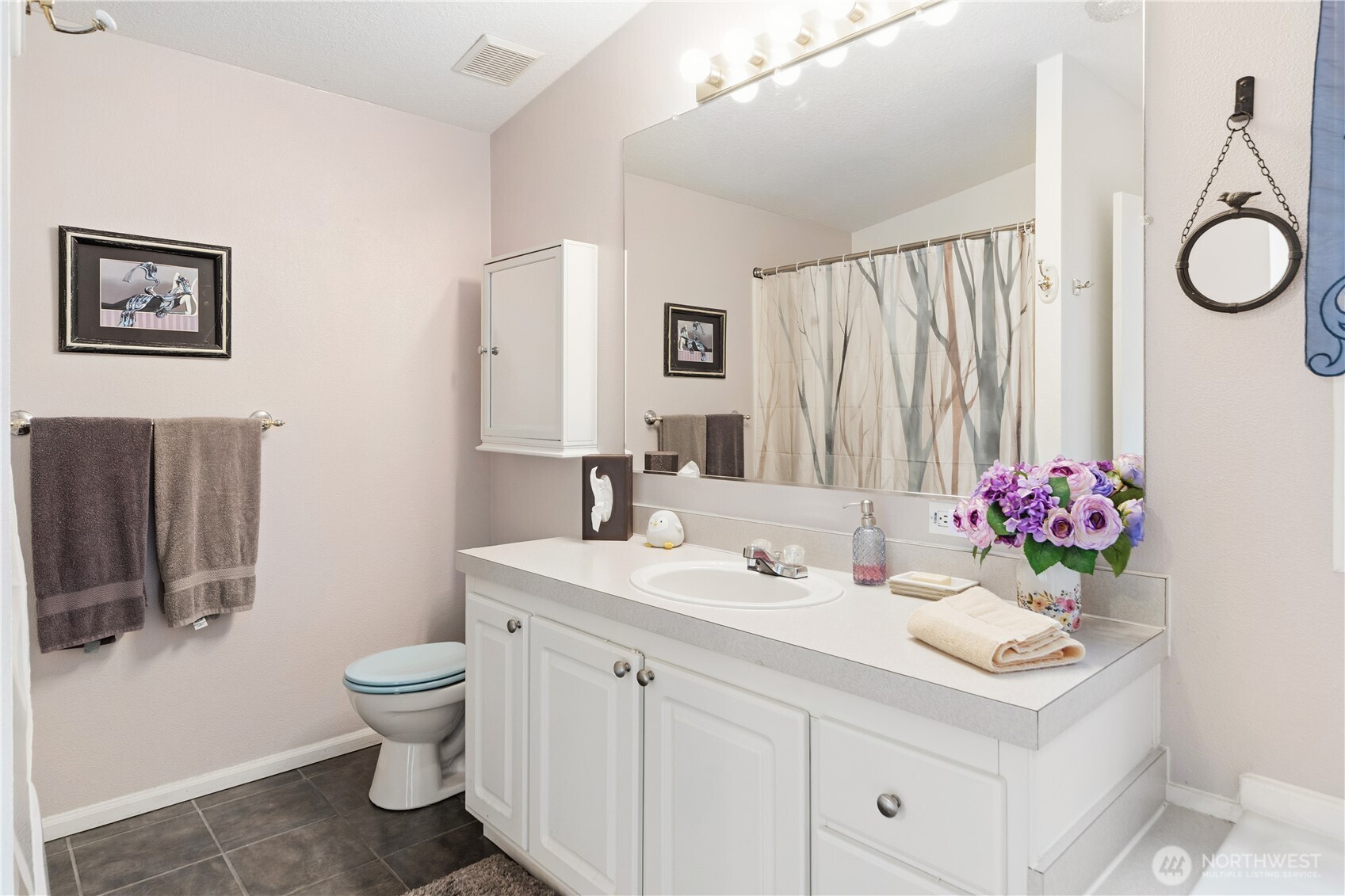 522 Frederick Street Port Townsend, WA 98368 - Photo 19 of 37 a bathroom with a sink vanity mirror and toilet