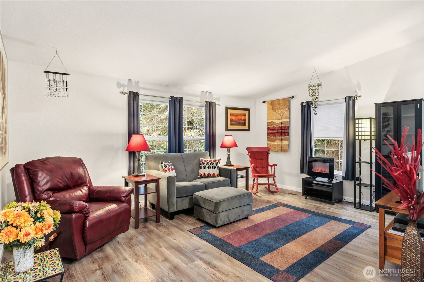 522 Frederick Street Port Townsend, WA 98368 - Photo 8 of 37 a living room with furniture a flat screen tv and a rug