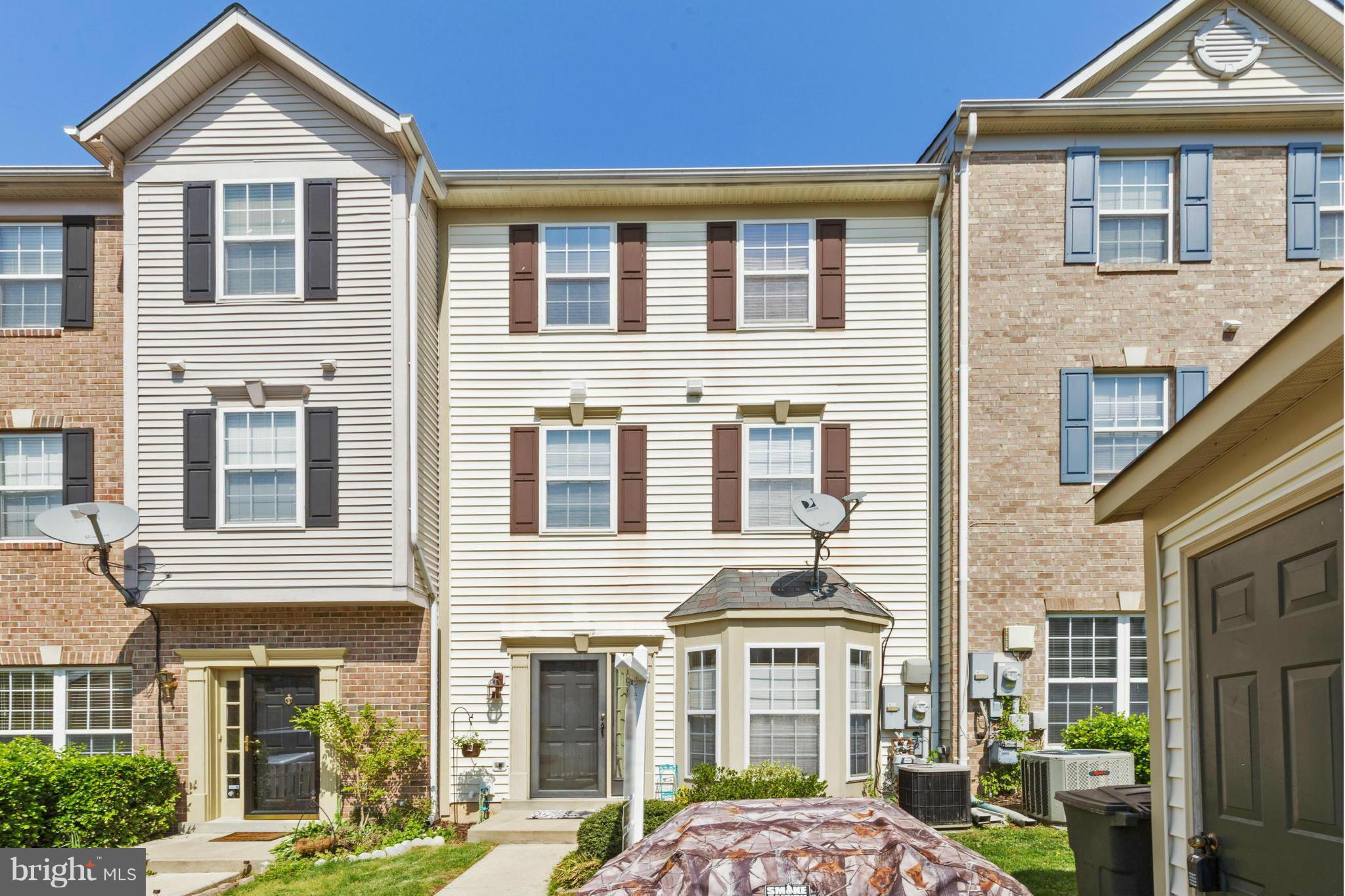 2005 Bell Point Court Odenton, MD 21113 - Photo 1 of 24 a front view of a residential apartment building with a yard