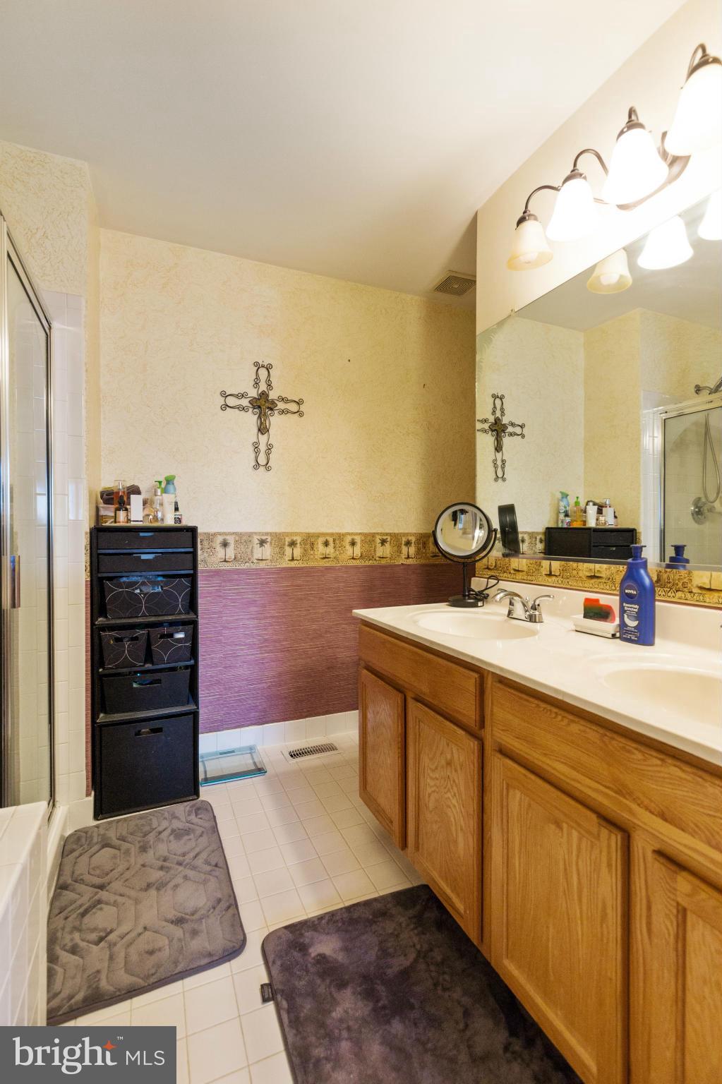 2005 Bell Point Court Odenton, MD 21113 - Photo 23 of 24 a spacious bathroom with a sink and a mirror