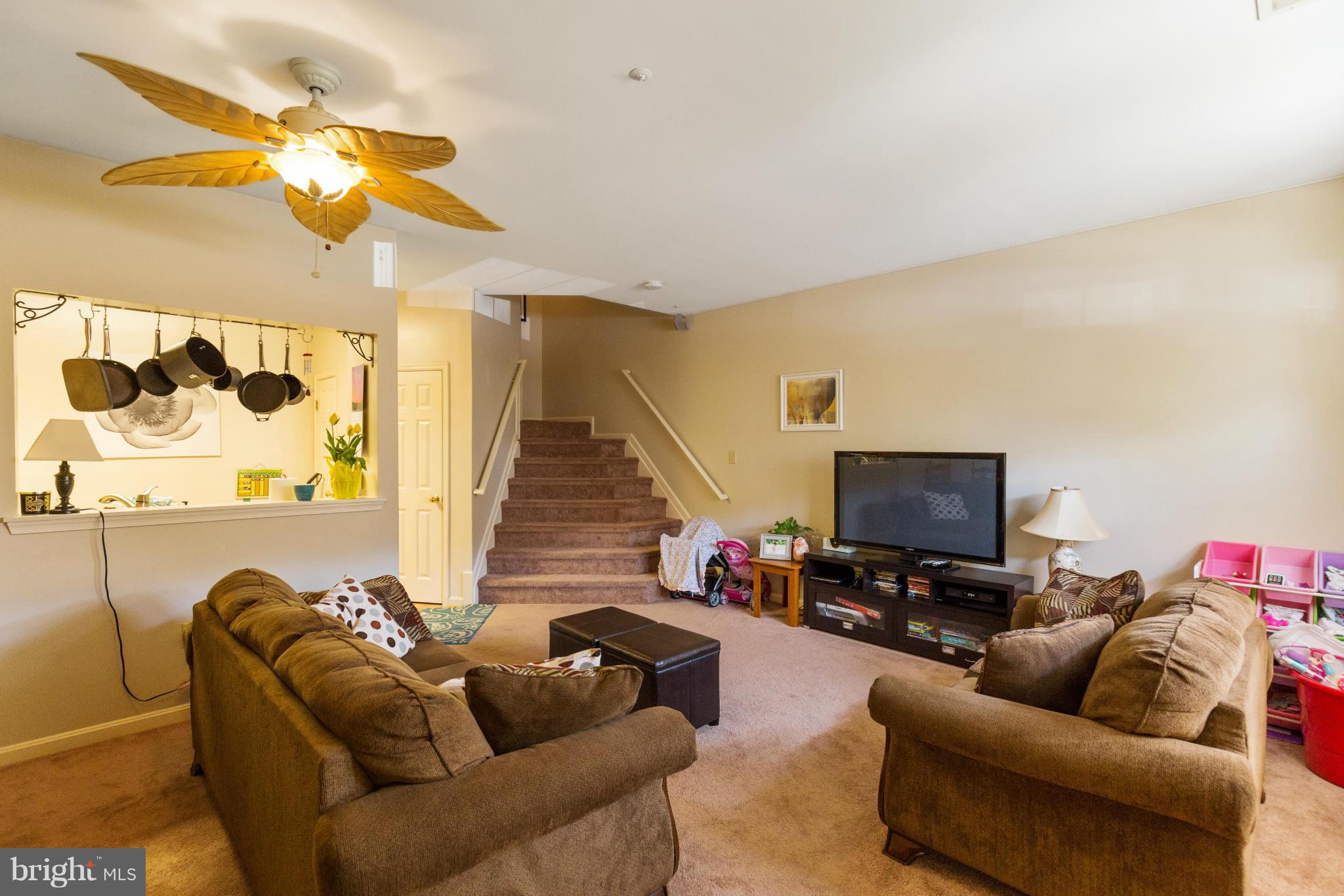 2005 Bell Point Court Odenton, MD 21113 - Photo 6 of 24 a living room with furniture and a flat screen tv