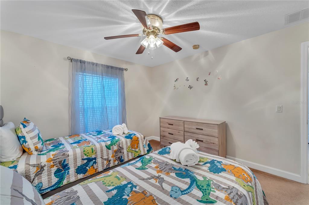 620 Old Bridge Circle Davenport, FL 33897 - Photo 15 of 22 a bedroom with bed and wooden floor