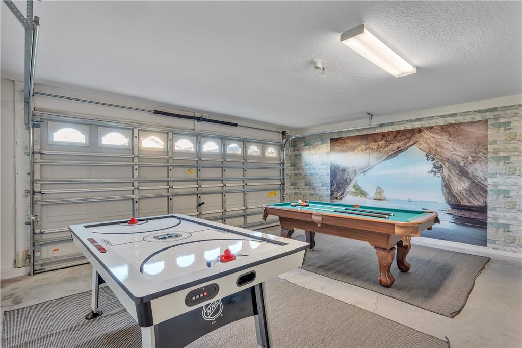 620 Old Bridge Circle Davenport, FL 33897 - Photo 18 of 22 a room with furniture pool table and wooden floor