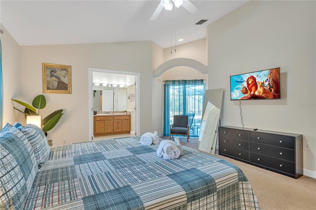 620 Old Bridge Circle Davenport, FL 33897 - Photo 19 of 22 a bedroom with a bed and furniture