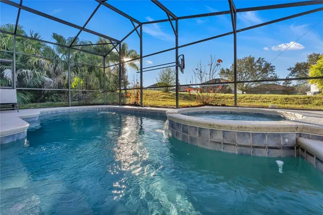 a view of a swimming pool with a yard
