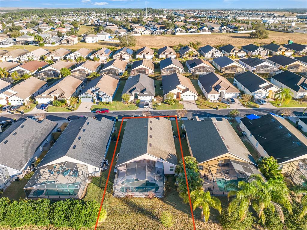 620 Old Bridge Circle Davenport, FL 33897 - Photo 21 of 22 an aerial view of residential houses with outdoor space
