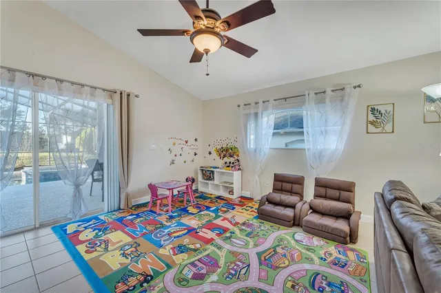 a bedroom with a large bed and potted plant