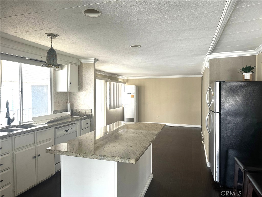 11250 Beach Boulevard, Unit 83 Stanton, CA 90680 - Photo 2 of 5 a kitchen with a sink refrigerator and window