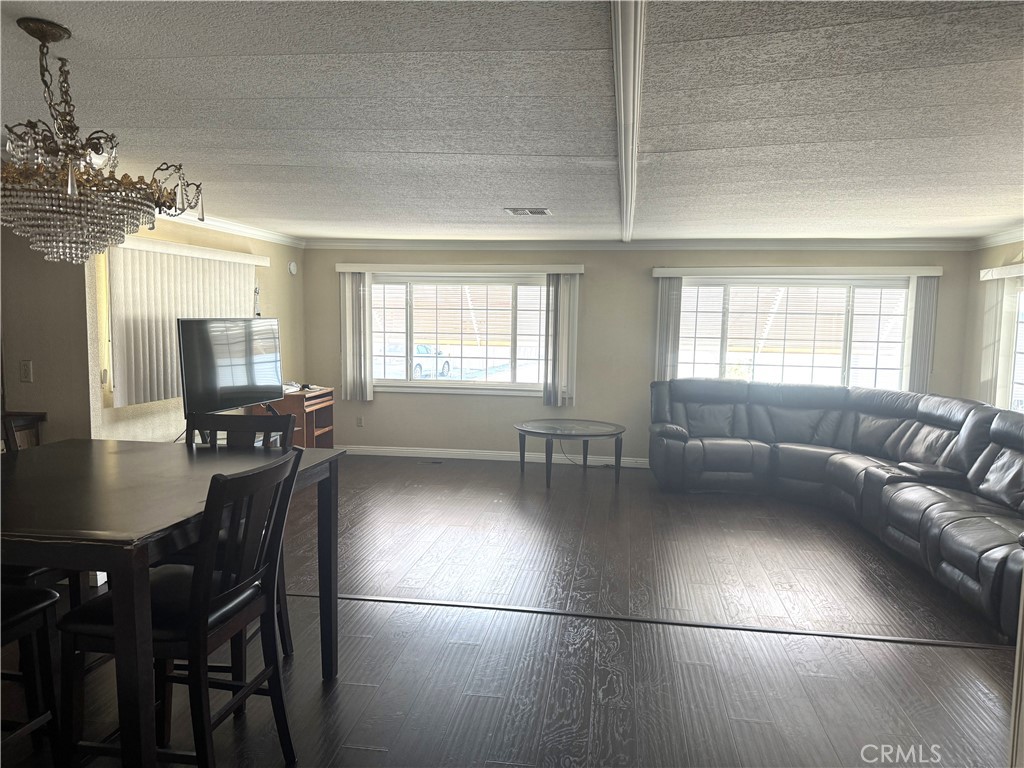 11250 Beach Boulevard, Unit 83 Stanton, CA 90680 - Photo 4 of 5 a living room with furniture and a chandelier