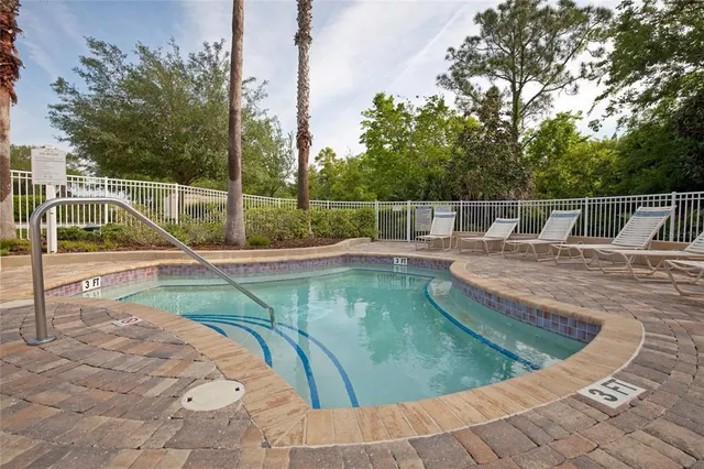 a view of a swimming pool with a sitting space