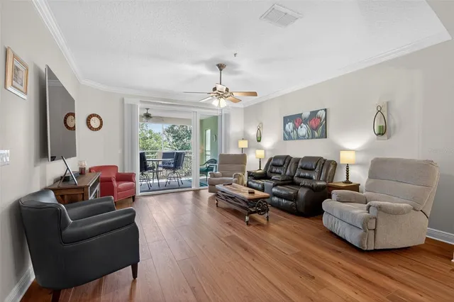 a living room with furniture fireplace and flat screen tv