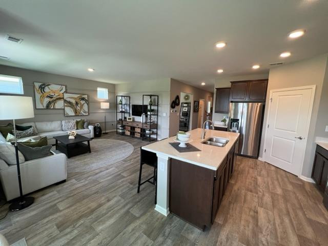 10400 Morse Place Crown Point, IN 46307 - Photo 19 of 33 a living room with stainless steel appliances kitchen island granite countertop furniture and wooden floor