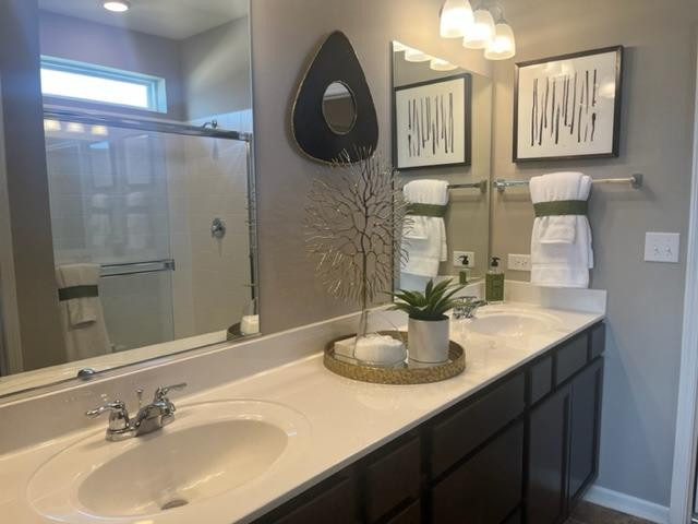 10400 Morse Place Crown Point, IN 46307 - Photo 27 of 33 a bathroom with a sink double vanity and a mirror