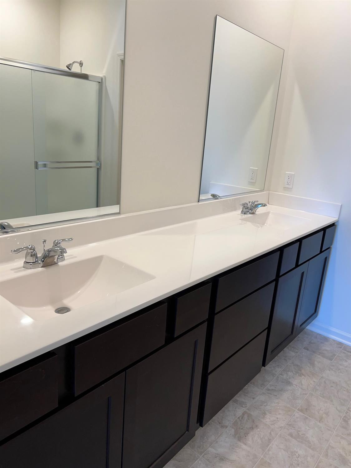 10400 Morse Place Crown Point, IN 46307 - Photo 9 of 33 a bathroom with a double vanity sink and a mirror