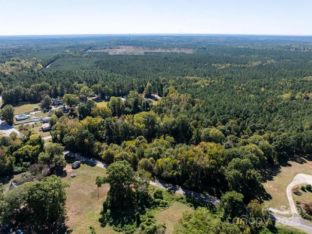 an aerial view of a house with mountain view