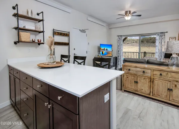 a kitchen with sink cabinets and window